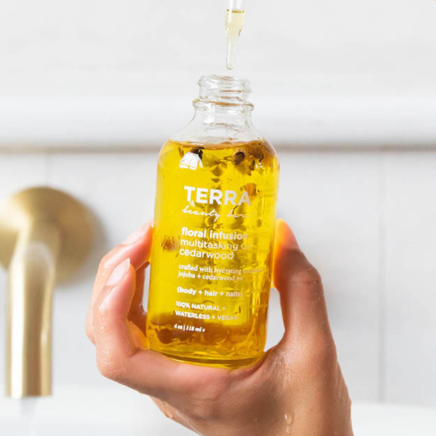 Floral Infusion body oil in hands
