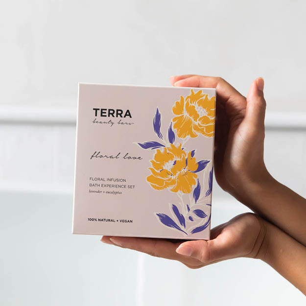 Terra Floral love gift box held by hands.