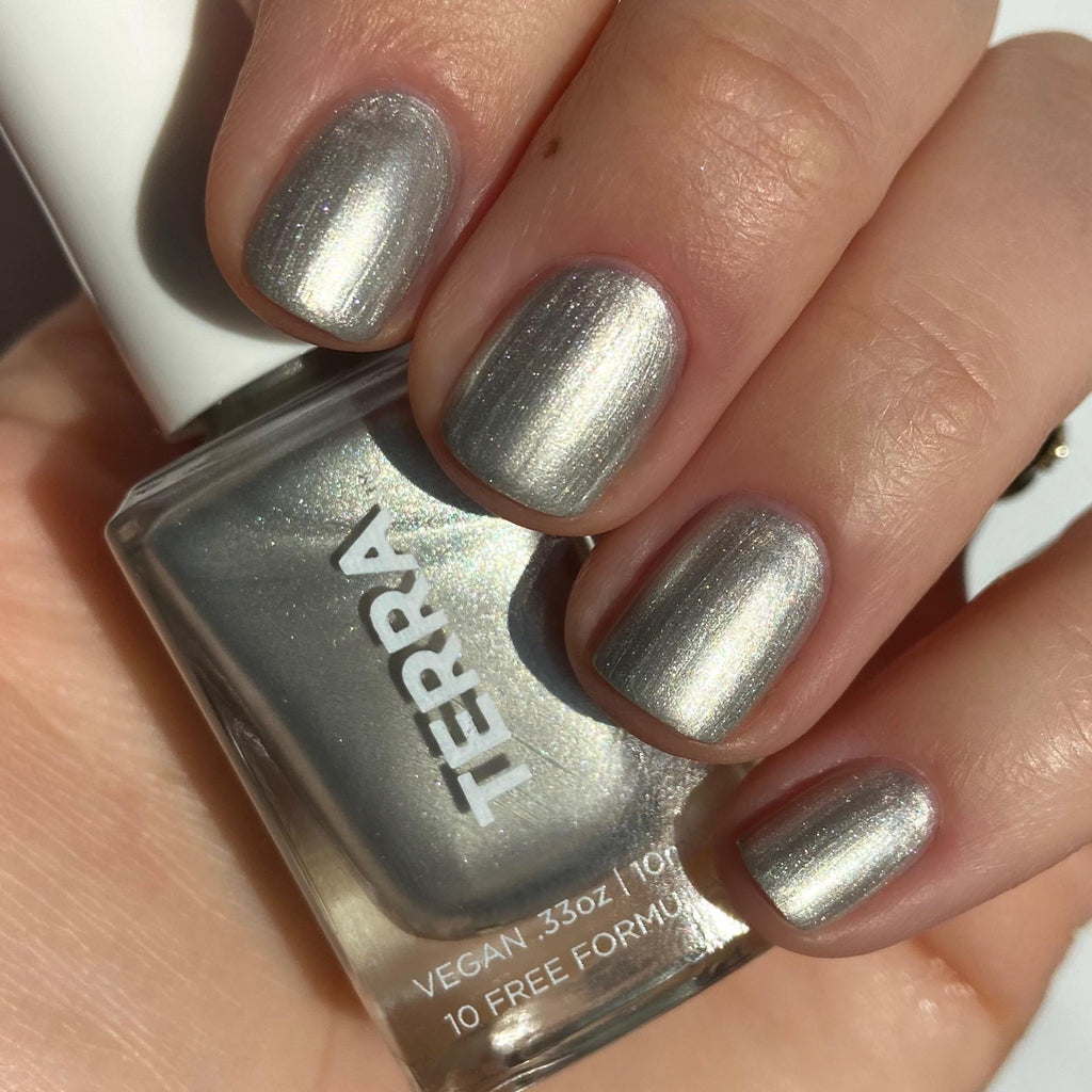 Terra nail polish number 27 soft silver shimmer swatched on nails.