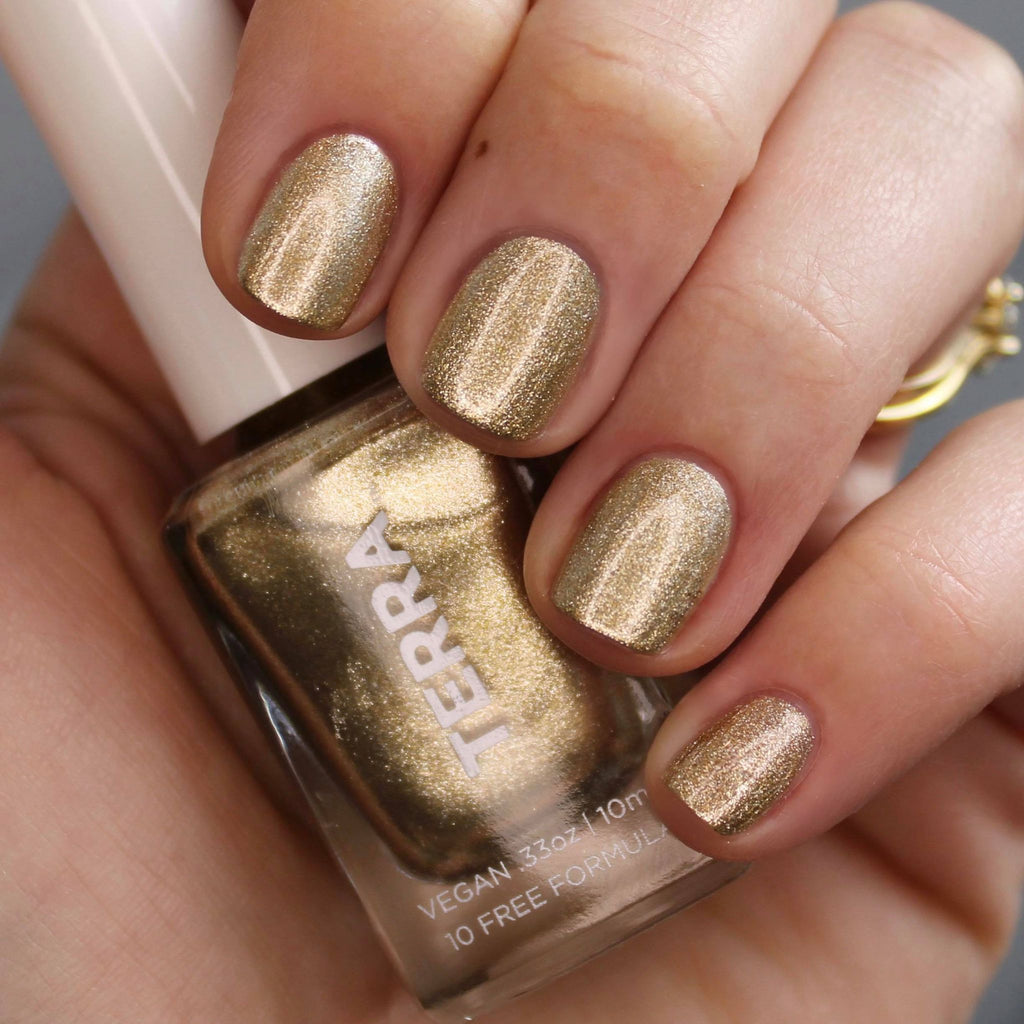 Terra nail polish number 28 gold foil swatched on nails.