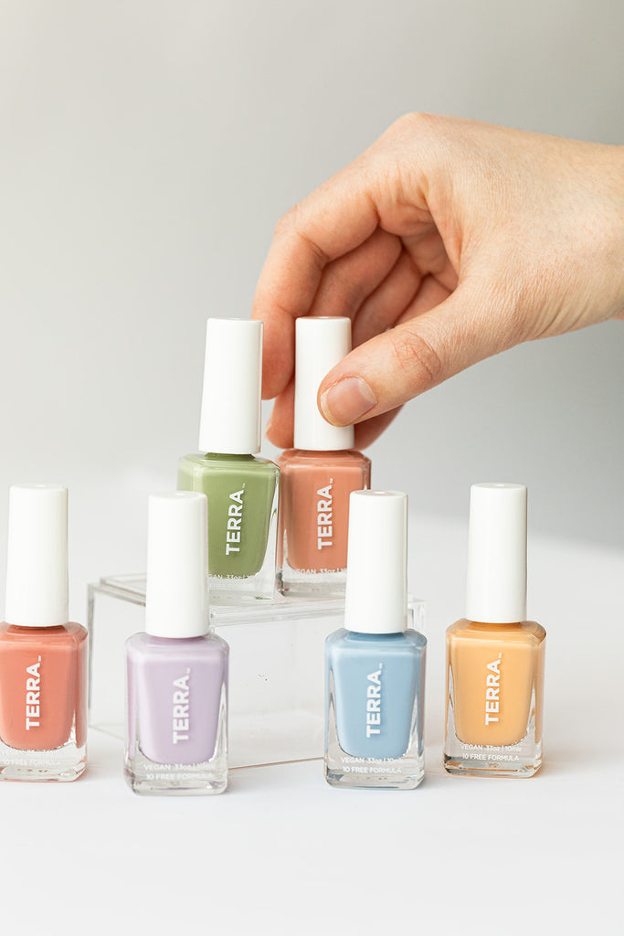 Spring nail polish collection featuring 6 colors to include number 16 Desert Sun (warm yellow color), number 17 Dusty Canyons (warm salmon / canyon color), number 18 Desert Lavender (true lavender color), number 24 Sage Green, number 32 TERRAcotta (terracotta)  number 31 Morning Dew (slate blue color)