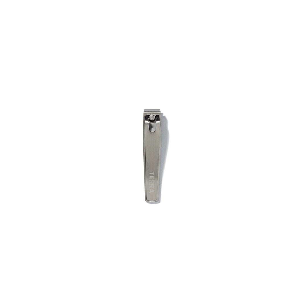 Small stainless steel flat edge nail clipper with terra logo engraved on it.