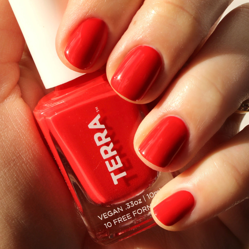 Terra nail polish number 30 bright pitanga red swatched on nails.