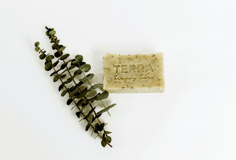 terra hand made yukari soap with eucalyptus leaves next to it