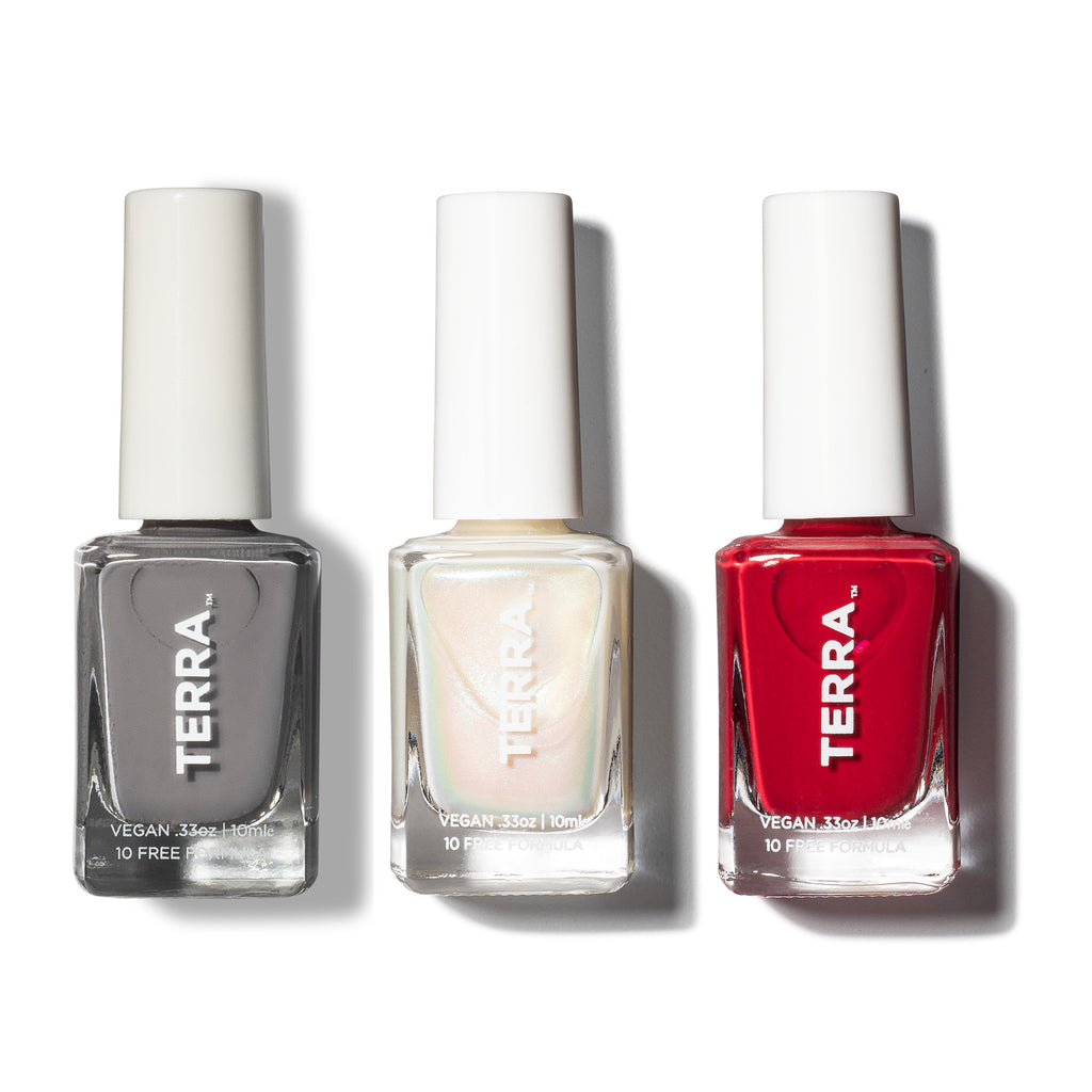 Three bottles of terra nail polish to include: No. 3 Gray (a Terra Founder Fav, this color works all year long and sits between a true light cement to cooler blue-gray shade); No. 45 Glazed (pearlescent shimmer that is now a classic staple); and No. 46 Crimson (a captivating red wine hue).