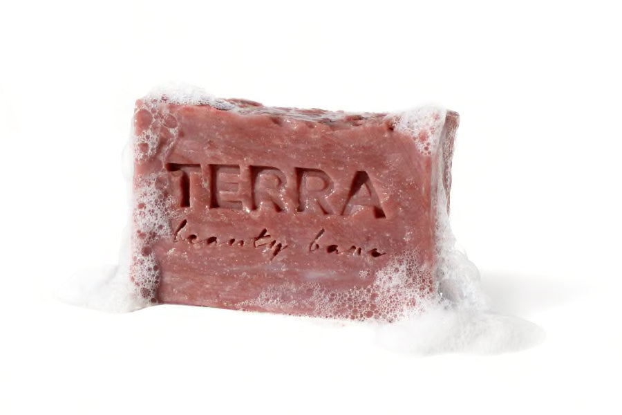 Solid Naked rose facial beauty bar with reship and Brazilian rose clay with bubbles around it, 4oz
